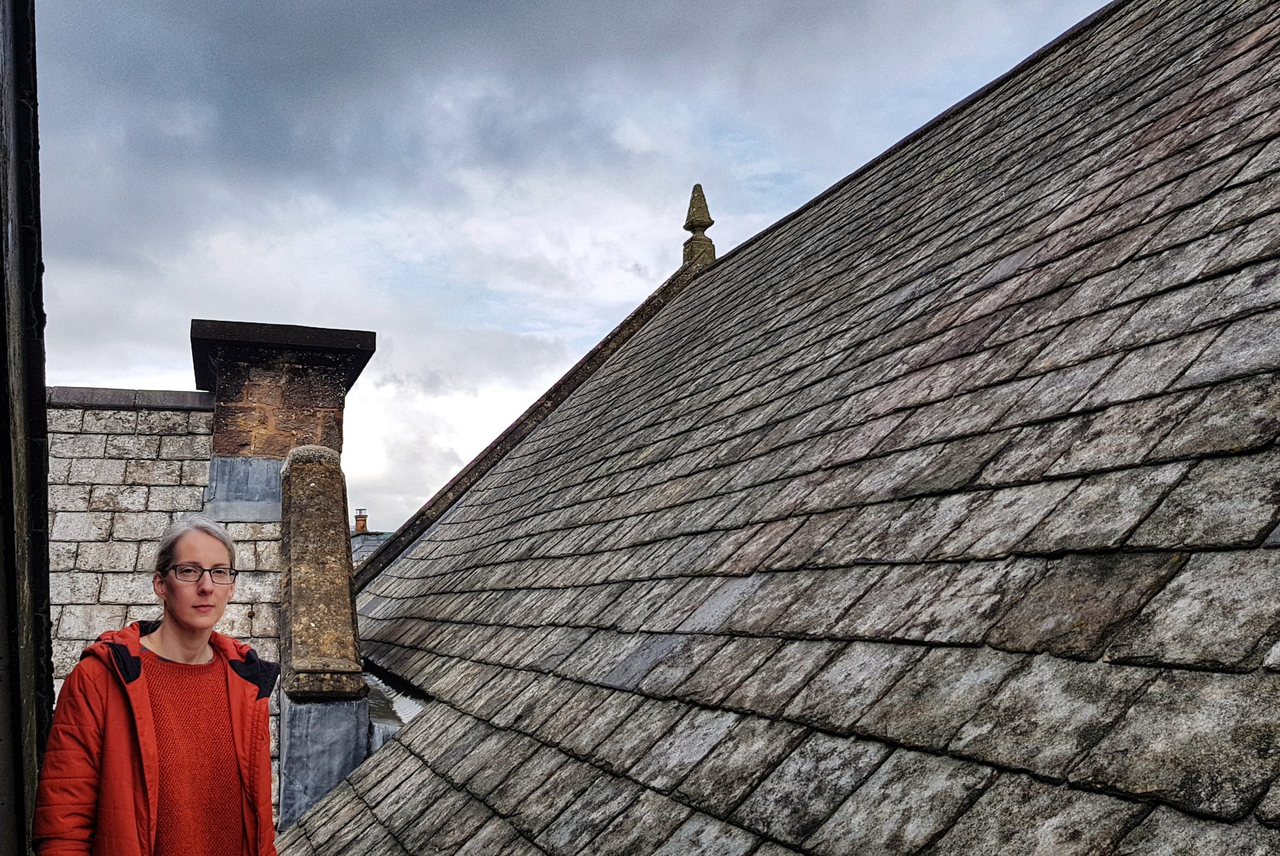 A woman standing on the roof of the museum