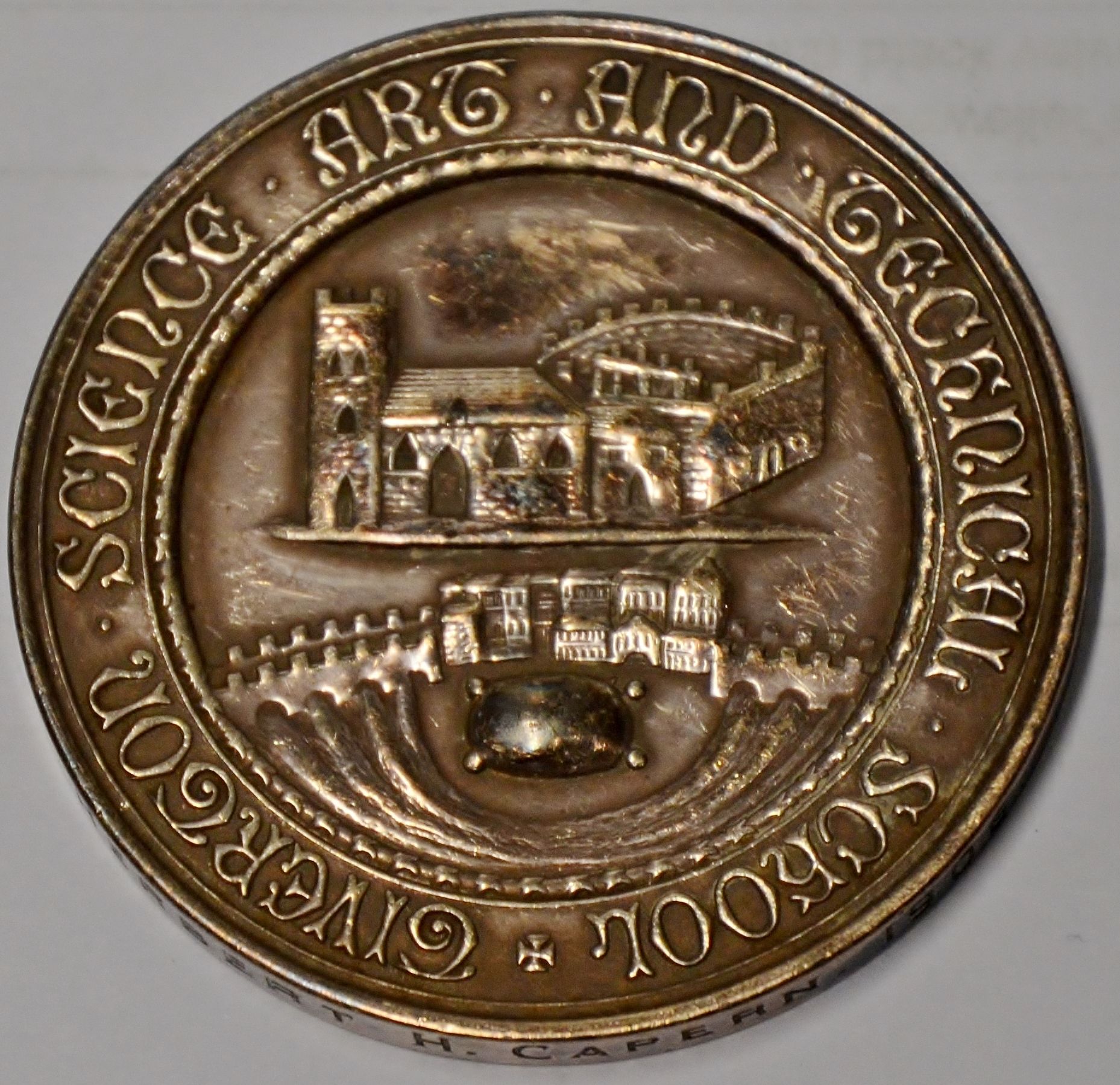 The Hadow medal showing the name of the school and a depiction of Tiverton