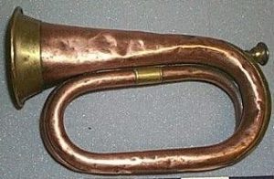 A brass bugle with a lighter coloured horn and mouthpiece. 