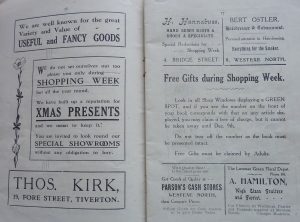 A double page spread of the Tiverton Shopping Week guide showing several adverts for Tiverton businesses from 1922. They include adverts for Thos. Kirk on Fore Street (We have built up a reputation for Xmas presents and we mean to keep it!), A Hamilton (High Class Fruiter and Florist) and Bert Ostler (Hairdresser and Tobacconist). 