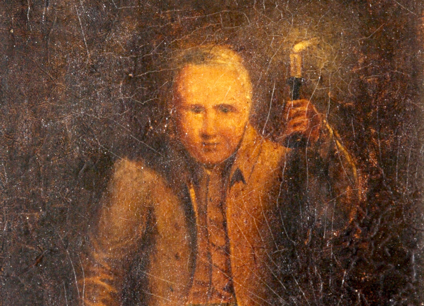 A painting of a man in a waistcoat holding a candle on a candlestick up. The image is quite dark but the man's face is illuminated.