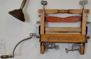 A small mangle that is wall mounted in the photo