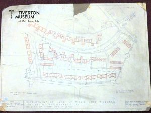 A hand drawn plan showing a street and housing